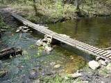 [Photo of a bridge crossing the creek]